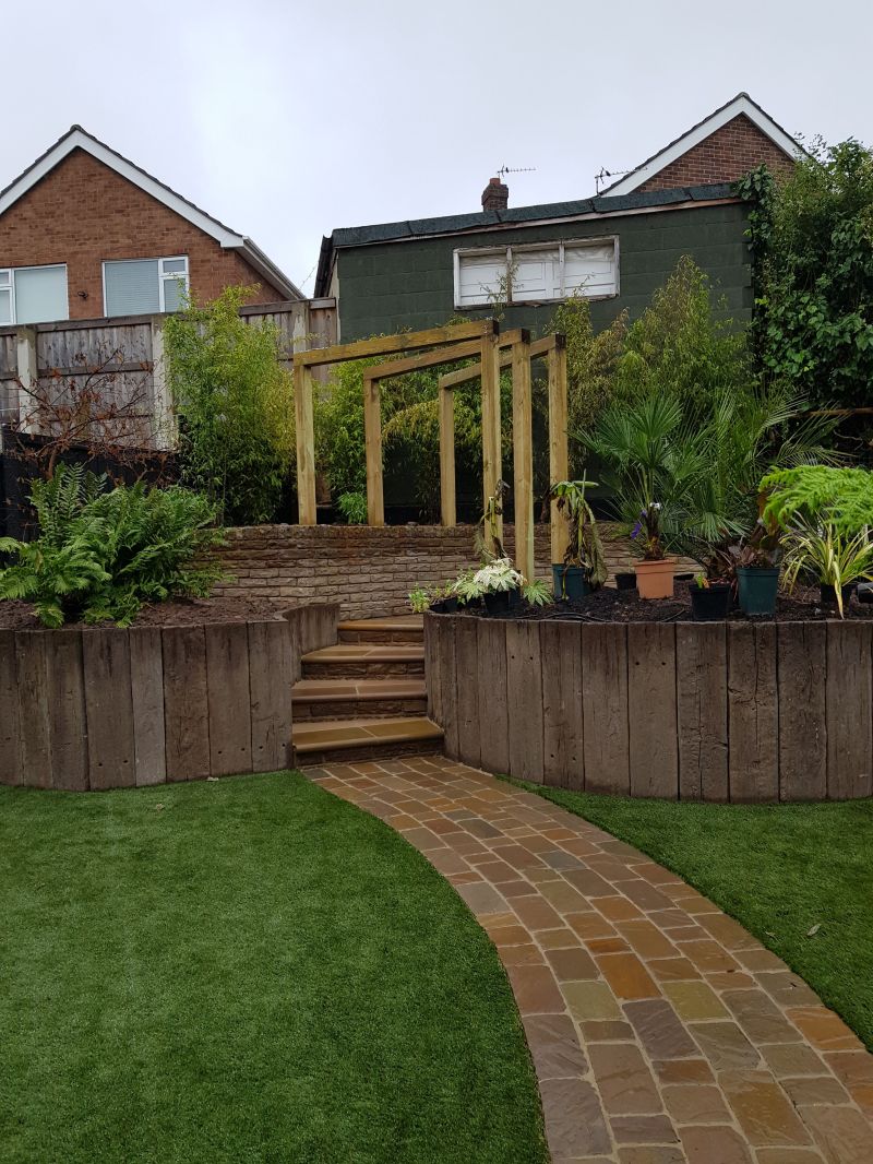 A lot of hard work went into this one, stone sett paths, timber arches, artificial grass and loads of new plants. Lovely job in Nottingham : Swipe To View More Images