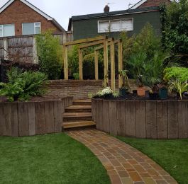 A lot of hard work went into this one, stone sett paths, timber arches, artificial grass and loads of new plants. Lovely job in Nottingham : Click Here To View Larger Image