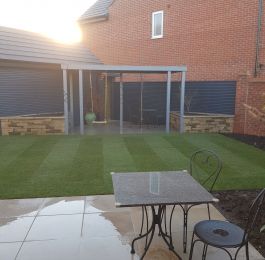 Small project in Edwalton, Nottingham. Timber pergola painted, Dry stone wall raised beds, new lawn and high end natural stone paving : Click Here To View Larger Image